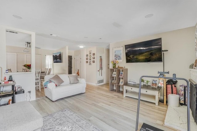 2111 Sanford St, Oxnard, CA 93033 - living room featuring visible vents and wood finished floors