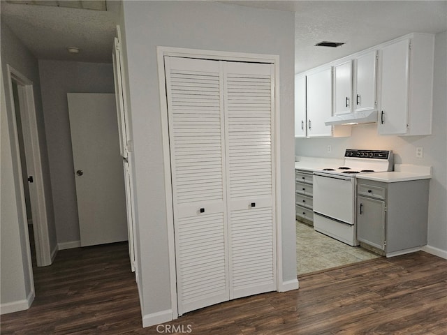 kitchen featuring under cabinet range hood, baseboards, dark wood finished floors, white electric range oven, and light countertops