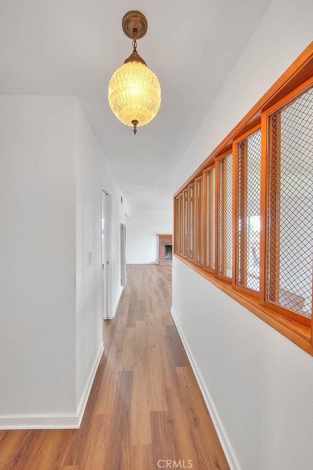 419 San Jacinto St, Redlands, CA 92373 - hallway with wood finished floors and baseboards