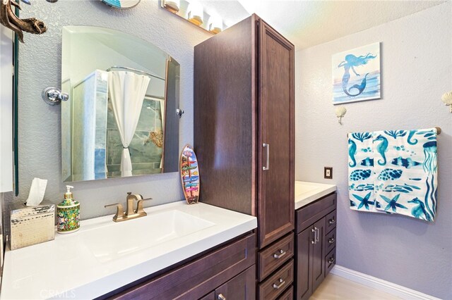 9387 Hot Springs Rd, Corona, CA 92883 - bathroom with walk in shower and vanity