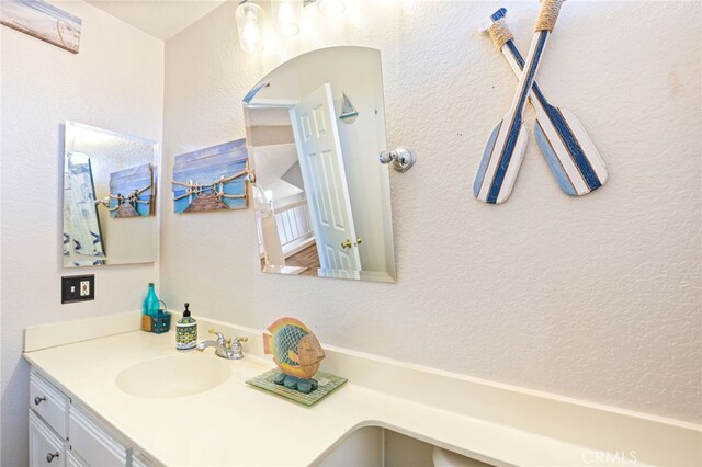 9387 Hot Springs Rd, Corona, CA 92883 - bathroom with vanity and a textured wall