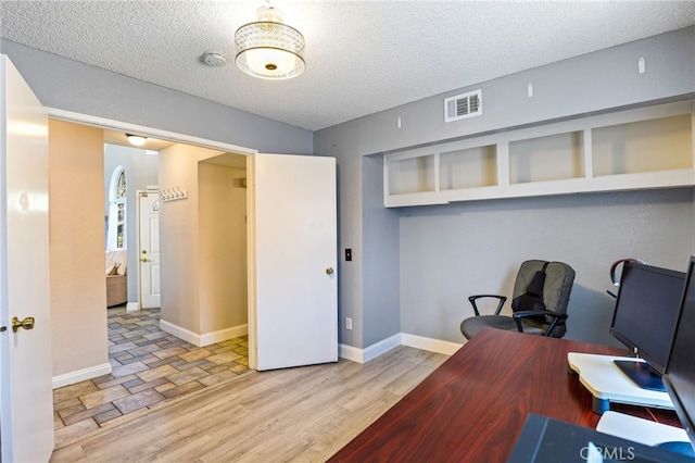 9387 Hot Springs Rd, Corona, CA 92883 - home office with a textured ceiling, visible vents, wood finished floors, and baseboards