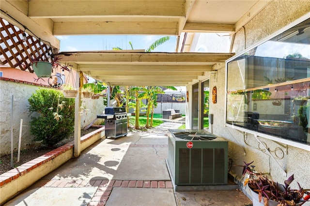 9387 Hot Springs Rd, Corona, CA 92883 - view of patio featuring a grill, fence, and central AC