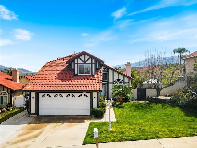 9387 Hot Springs Rd, Corona, CA 92883 - english style home with concrete driveway, a tiled roof, stucco siding, and a front yard