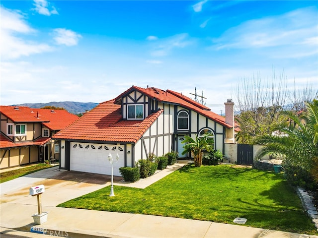 9387 Hot Springs Rd, Corona, CA 92883 - tudor-style house featuring a tile roof, concrete driveway, a garage, stucco siding, and a front yard