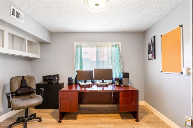 9387 Hot Springs Rd, Corona, CA 92883 - office with a textured ceiling, visible vents, light wood-style flooring, and baseboards