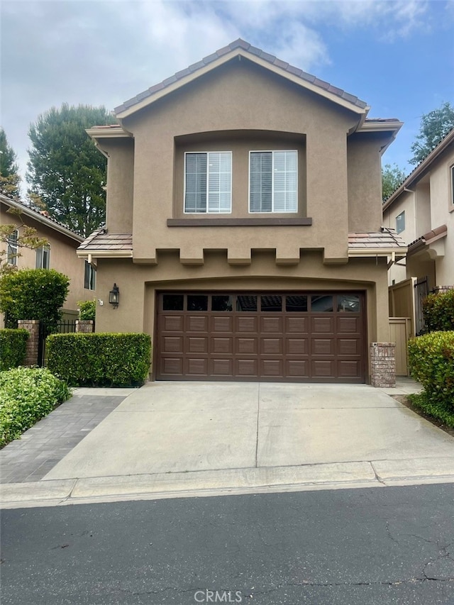 1129 W Capitol Dr Unit 29, San Pedro, CA 90732 - traditional home with fence, a garage, stucco siding, and driveway
