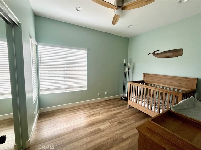 1129 W Capitol Dr Unit 29, San Pedro, CA 90732 - bedroom featuring multiple windows, wood finished floors, and baseboards