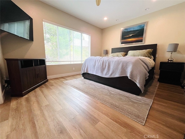 bedroom with baseboards, light wood-style flooring, and recessed lighting