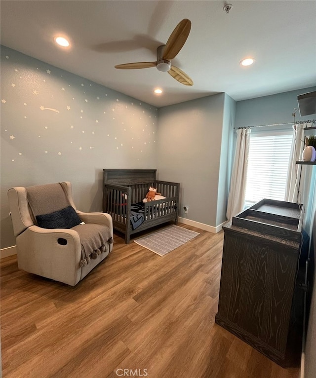 1129 W Capitol Dr Unit 29, San Pedro, CA 90732 - bedroom with light wood finished floors, baseboards, ceiling fan, and recessed lighting