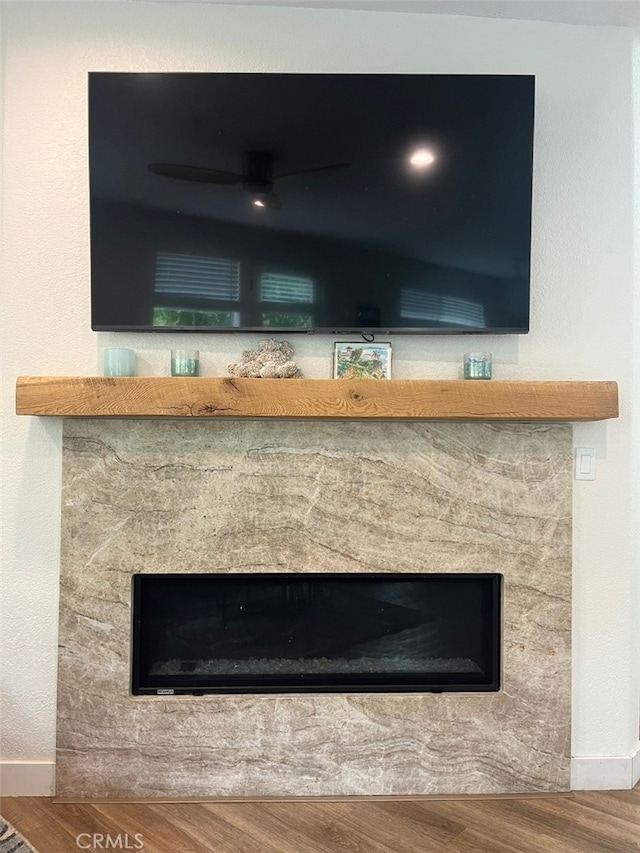 1129 W Capitol Dr Unit 29, San Pedro, CA 90732 - interior details featuring baseboards, a fireplace, ceiling fan, and wood finished floors