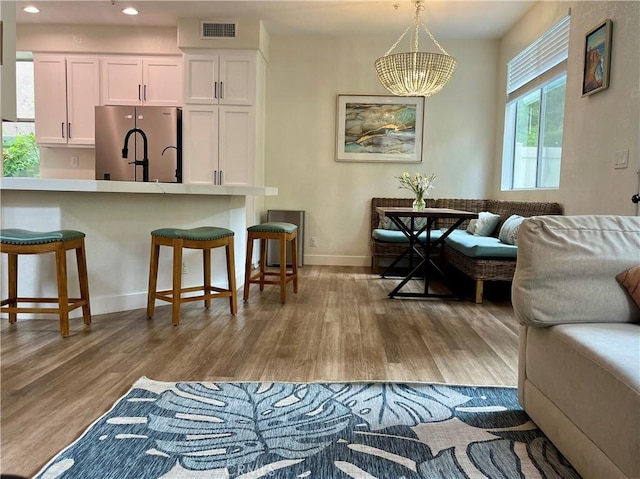 1129 W Capitol Dr Unit 29, San Pedro, CA 90732 - living room with wood finished floors, baseboards, recessed lighting, and a chandelier