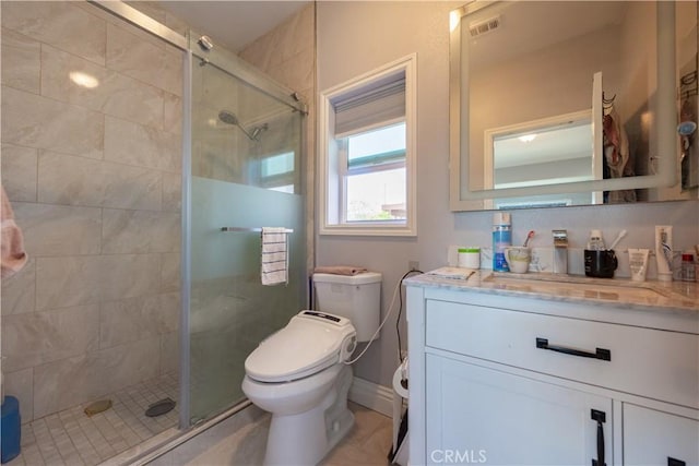 full bath with toilet, a stall shower, visible vents, tile patterned flooring, and vanity