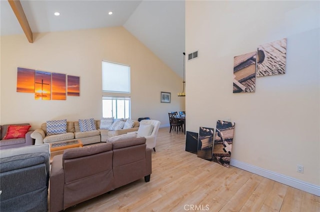 living room with recessed lighting, baseboards, visible vents, high vaulted ceiling, and light wood-type flooring