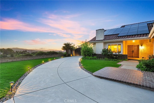 2302 Delfs Ln, Rowland Heights, CA 91748 - view of front of house featuring solar panels, a tiled roof, and stucco siding