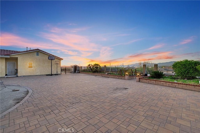 view of patio / terrace featuring fence and a gate