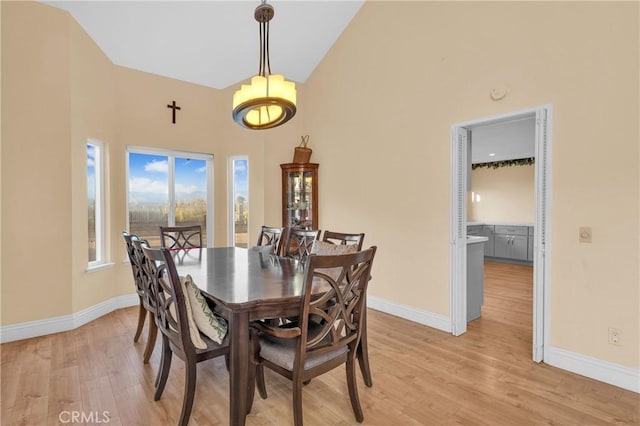 2302 Delfs Ln, Rowland Heights, CA 91748 - dining space featuring baseboards, high vaulted ceiling, and light wood-type flooring