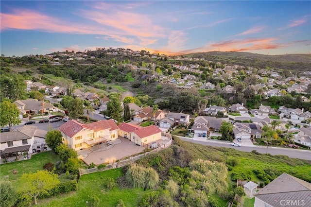 aerial view at dusk with a residential view