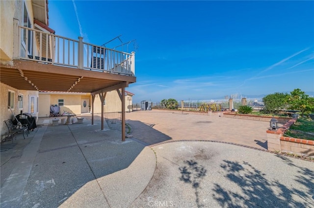view of patio / terrace featuring fence