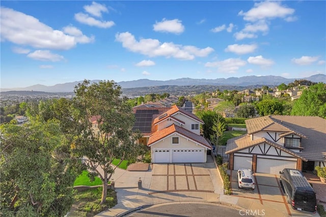 exterior space with a residential view and a mountain view