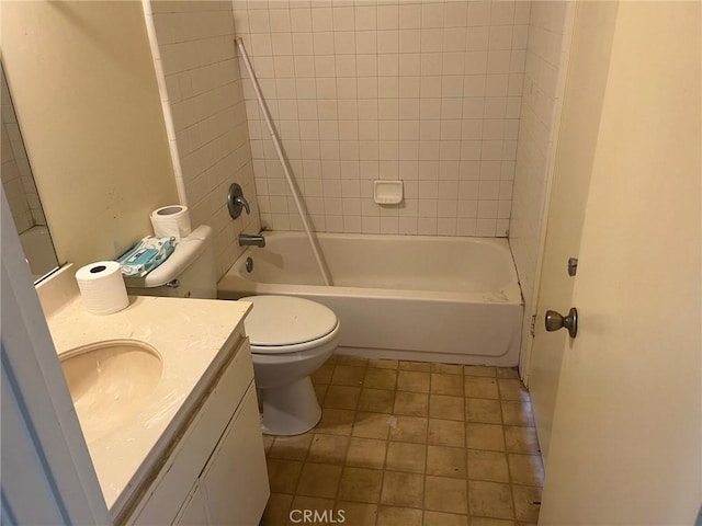bathroom featuring toilet,  shower combination, and vanity