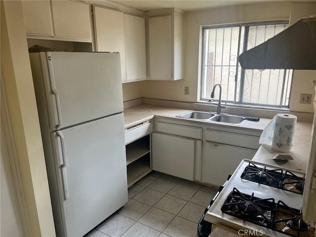 kitchen featuring a sink, white appliances, exhaust hood, light countertops, and light tile patterned floors