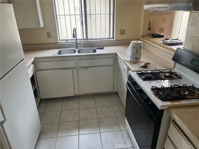 kitchen with a sink, extractor fan, white appliances, light countertops, and white cabinets