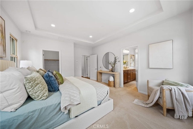 33 Jonquil, Irvine, CA 92618 - bedroom with a closet, a tray ceiling, recessed lighting, a walk in closet, and light colored carpet