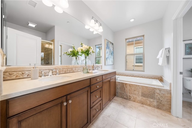 33 Jonquil, Irvine, CA 92618 - bathroom featuring a garden tub, visible vents, a stall shower, and a sink