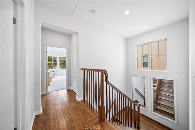 33 Jonquil, Irvine, CA 92618 - corridor with an upstairs landing, dark wood finished floors, recessed lighting, and baseboards