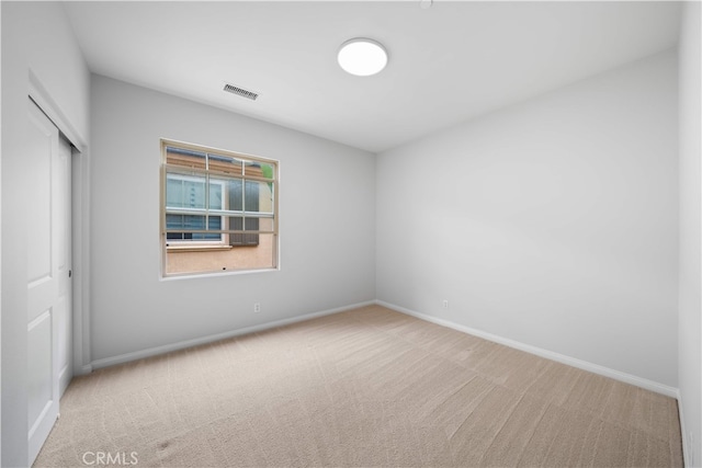 33 Jonquil, Irvine, CA 92618 - unfurnished bedroom with carpet flooring, a closet, baseboards, and visible vents