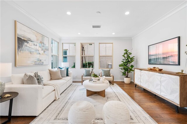 33 Jonquil, Irvine, CA 92618 - living area with recessed lighting, baseboards, visible vents, crown molding, and wood finished floors
