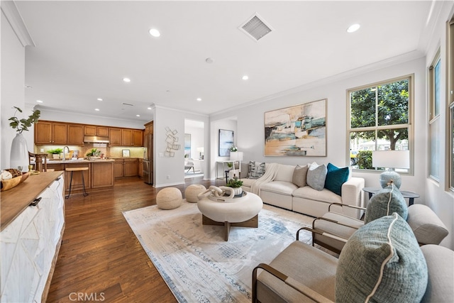 33 Jonquil, Irvine, CA 92618 - living room with recessed lighting, visible vents, ornamental molding, and dark wood-type flooring