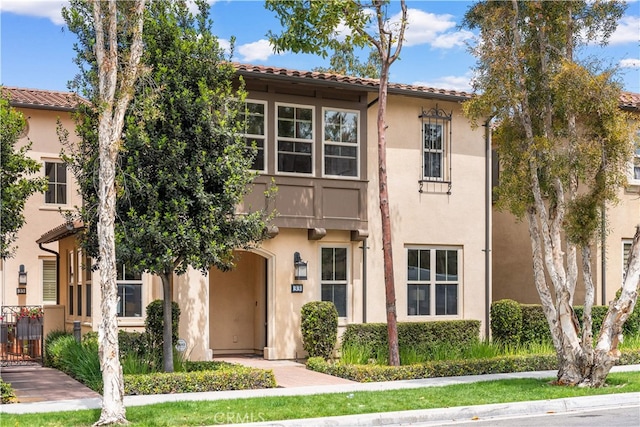 33 Jonquil, Irvine, CA 92618 - view of front of property featuring stucco siding and a tiled roof