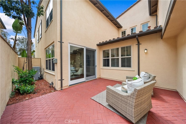 33 Jonquil, Irvine, CA 92618 - back of house with a patio area, cooling unit, stucco siding, and fence