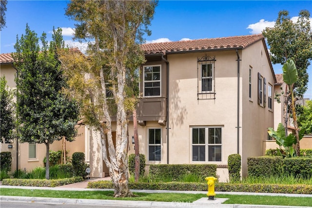 33 Jonquil, Irvine, CA 92618 - view of front facade featuring stucco siding and a tiled roof