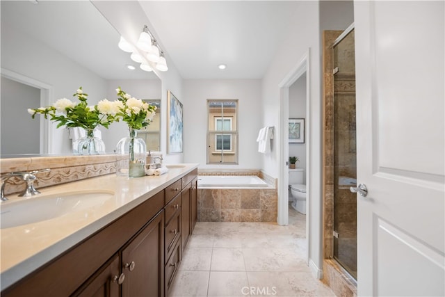 33 Jonquil, Irvine, CA 92618 - bathroom featuring a sink, toilet, a shower stall, double vanity, and a garden tub