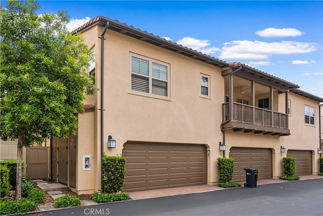 33 Jonquil, Irvine, CA 92618 - exterior space featuring stucco siding, a garage, and a balcony