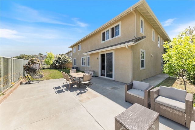 16673 Carob Ave, Chino Hills, CA 91709 - rear view of property with stucco siding, a fenced backyard, a patio area, outdoor dining area, and an outdoor living space