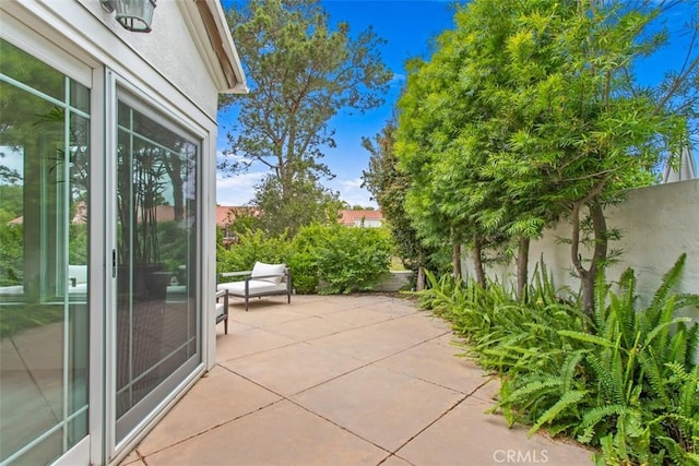 view of patio featuring fence