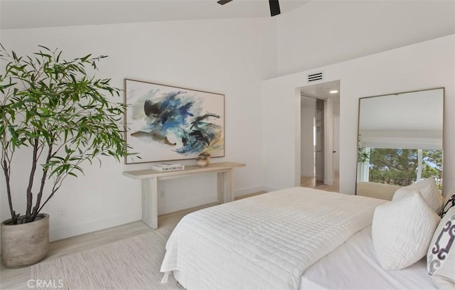 bedroom featuring visible vents, wood finished floors, and baseboards