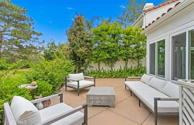 view of patio / terrace with outdoor lounge area and fence