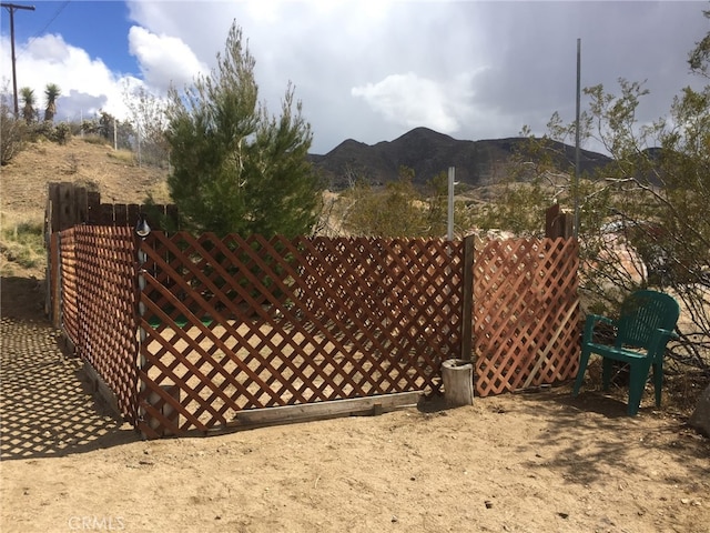 view of gate featuring a mountain view