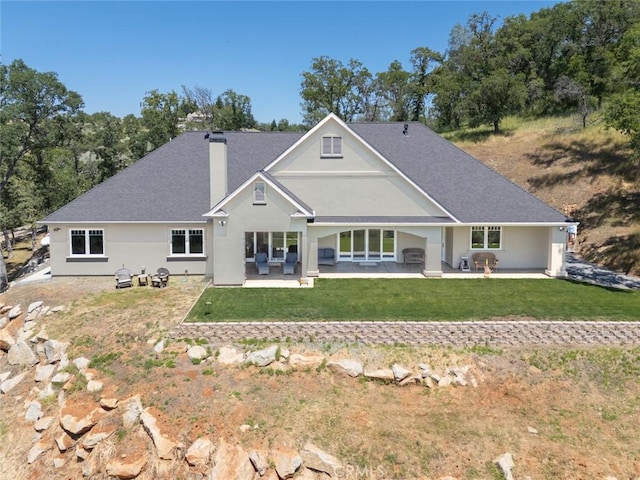 2483 Manhattan Bar Rd, Auburn, CA 95603 - rear view of house featuring a chimney, a patio, a lawn, and a shingled roof