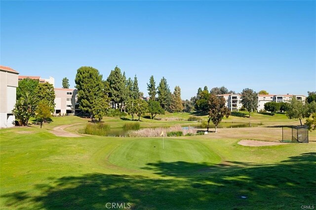 663 Via Los Altos Unit Q, Laguna Woods, CA 92637 - view of community with golf course view, a yard, and a water view