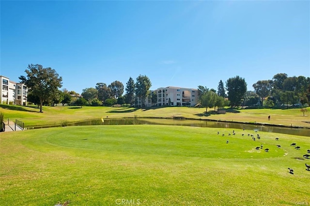 663 Via Los Altos Unit Q, Laguna Woods, CA 92637 - view of community with a water view, view of golf course, and a lawn