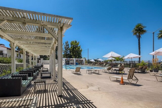 663 Via Los Altos Unit Q, Laguna Woods, CA 92637 - view of patio / terrace with a community pool and a pergola