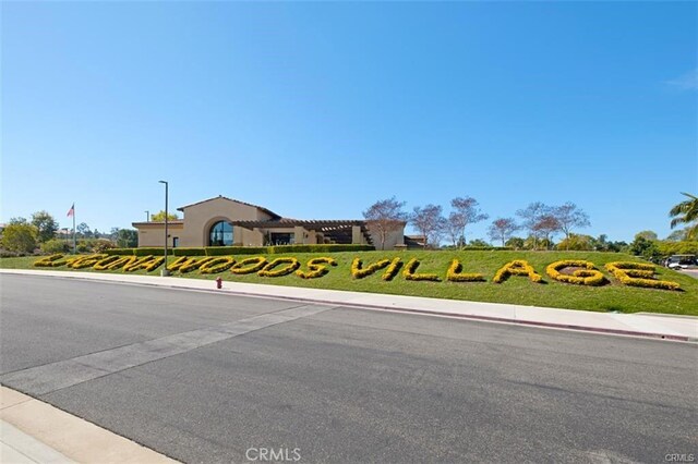 663 Via Los Altos Unit Q, Laguna Woods, CA 92637 - view of asphalt street with street lighting, sidewalks, and curbs