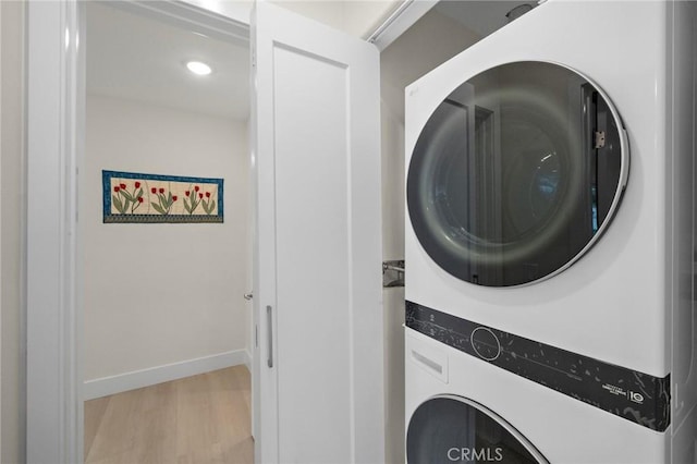 663 Via Los Altos Unit Q, Laguna Woods, CA 92637 - laundry room with estacked washer and dryer, light wood-style floors, baseboards, and recessed lighting