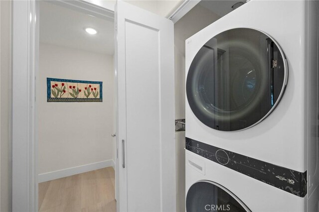 663 Via Los Altos Unit Q, Laguna Woods, CA 92637 - laundry room featuring estacked washer and dryer, light wood-style flooring, baseboards, and recessed lighting